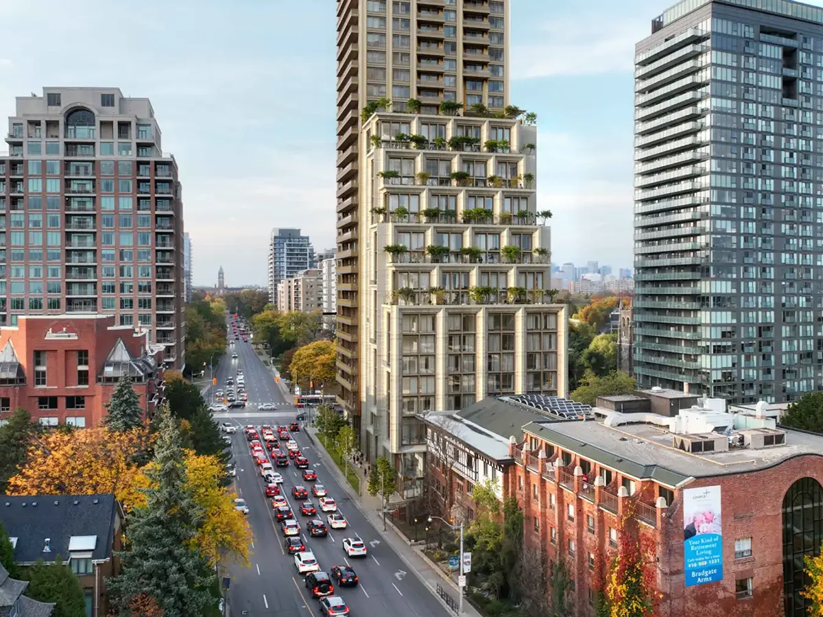 Rendering showing proposed tall condo building surrounded by existing mix of low, midrise and highrise buildings along a busy city street.